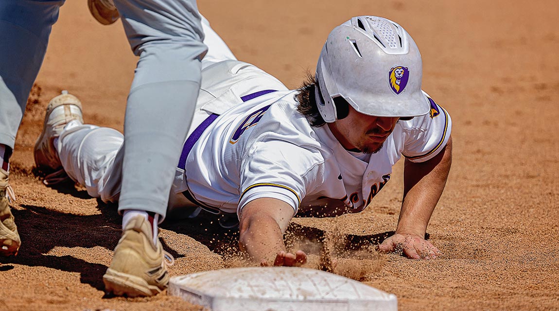 MCC Scots player sliding into the base.