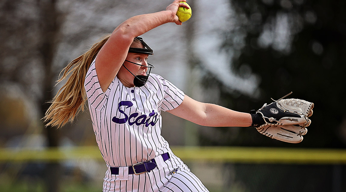 A Scots softball pitcher prepares to release a pitch. 