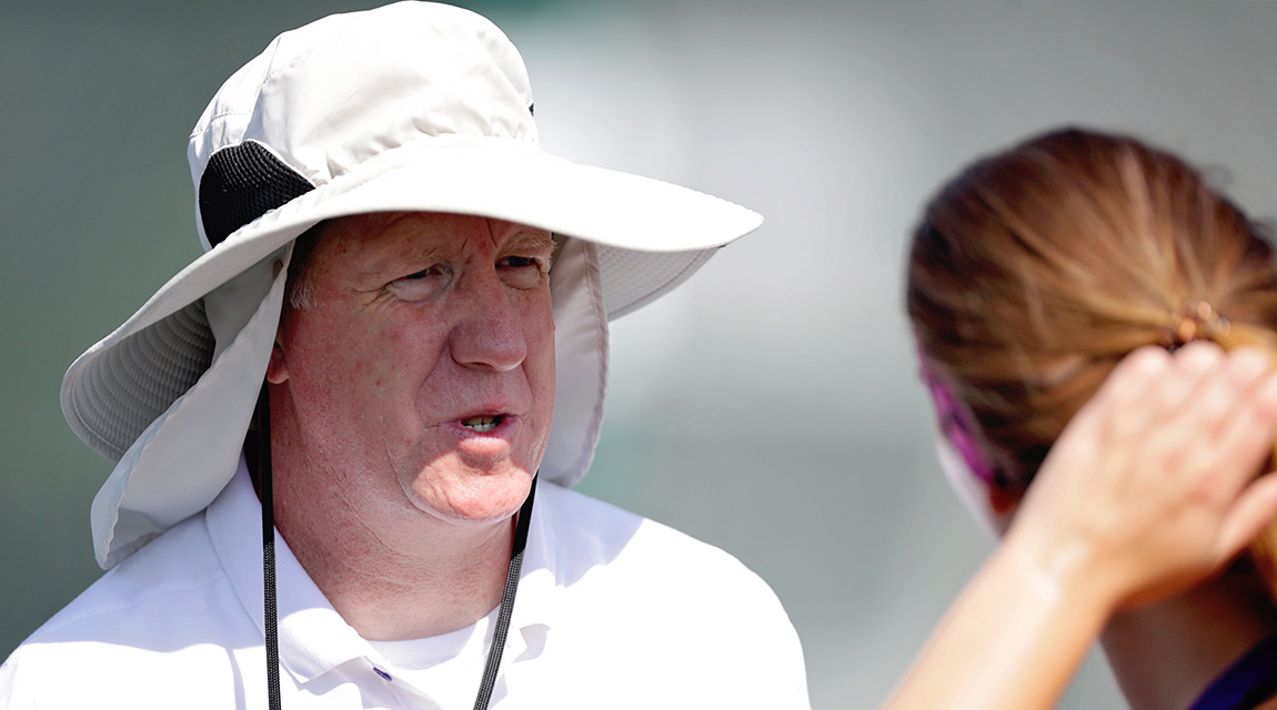 Women's Tennis Coach, Jim Stockwell, speaks with a player